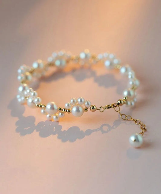 Elegant White Alloy Bracelet – Pearls & Cat Claw Design